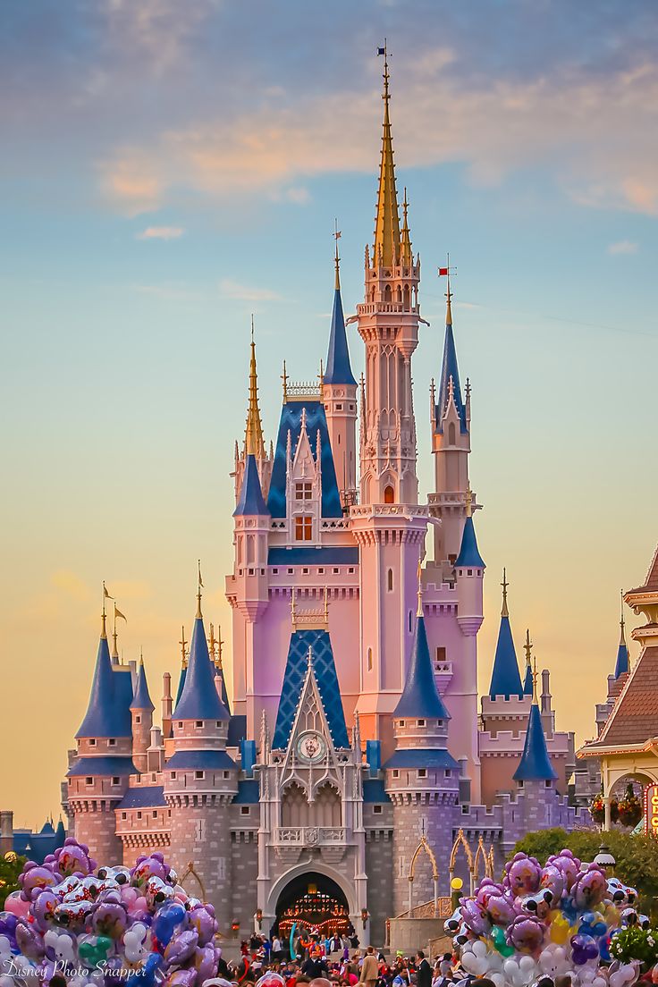 a castle with lots of balloons in front of it