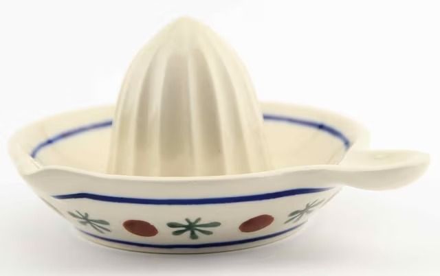 a white and blue bowl with a spoon in it's center, on a white background