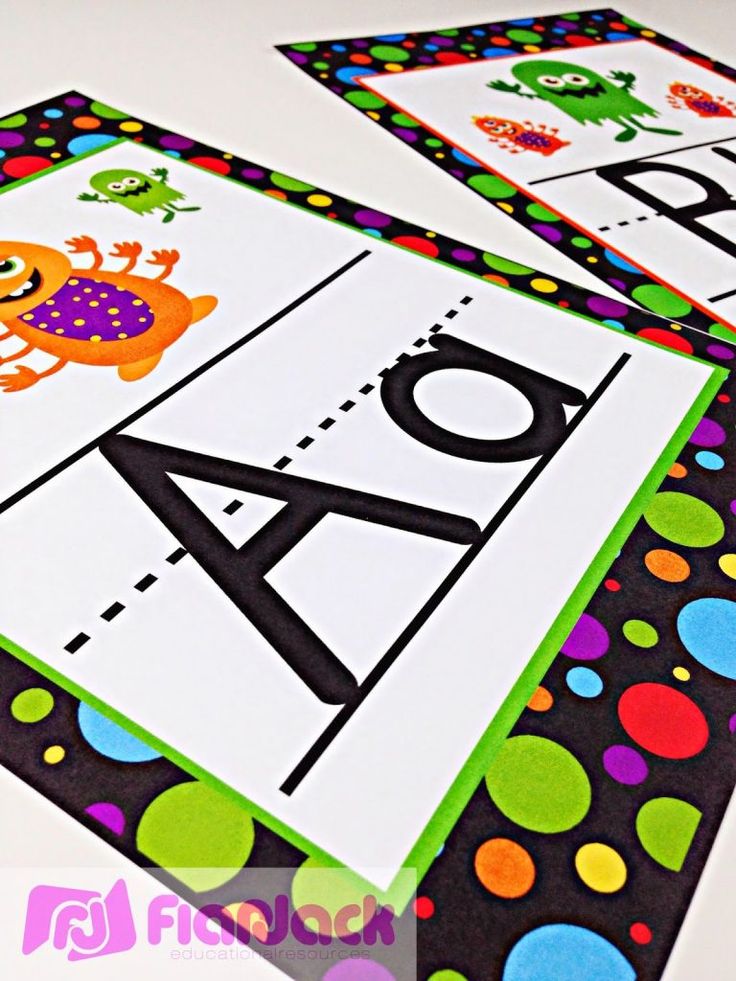 three different types of alphabets are displayed on the table with colorful polka dot dots