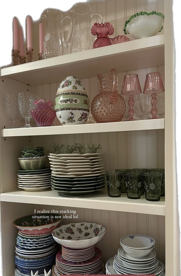 a shelf filled with lots of plates and bowls