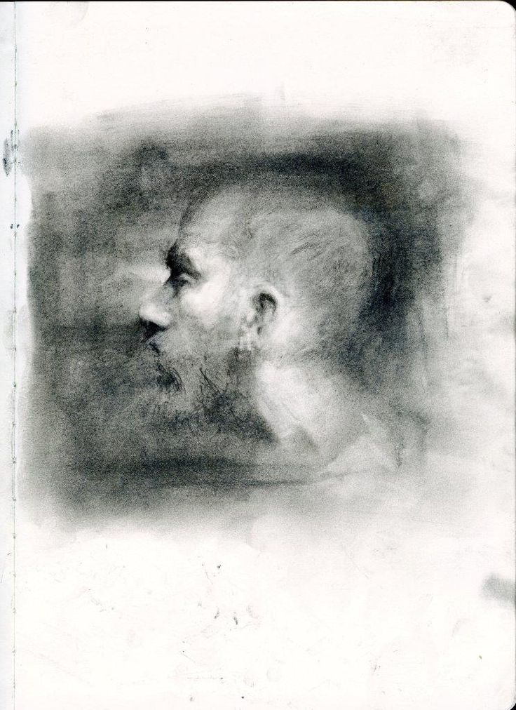 a black and white photo of a man's face with his head turned to the side