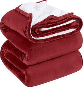 three red and white blankets stacked on top of each other