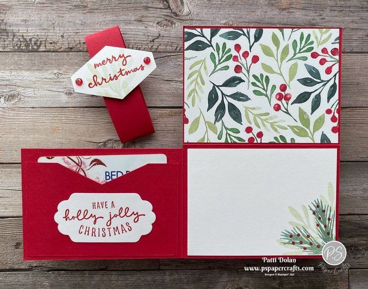 three christmas cards on top of each other, one is red and the other has green leaves