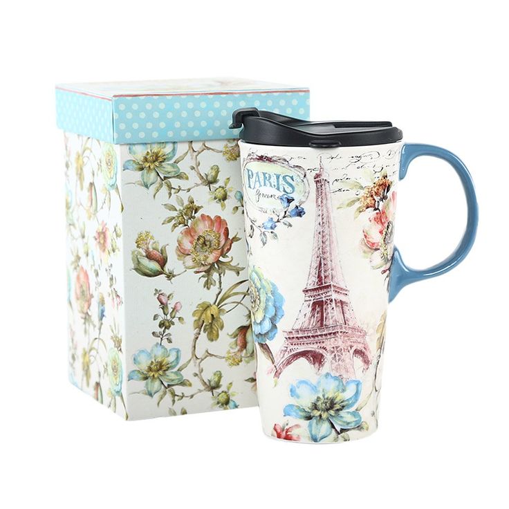 two coffee mugs with the eiffel tower on them