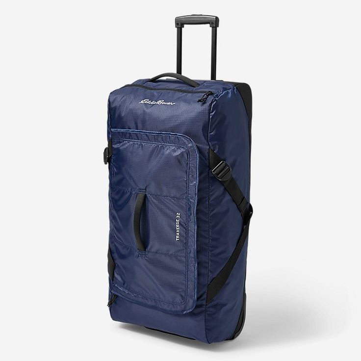 a blue piece of luggage on wheels with handles and zippers is shown in front of a white background