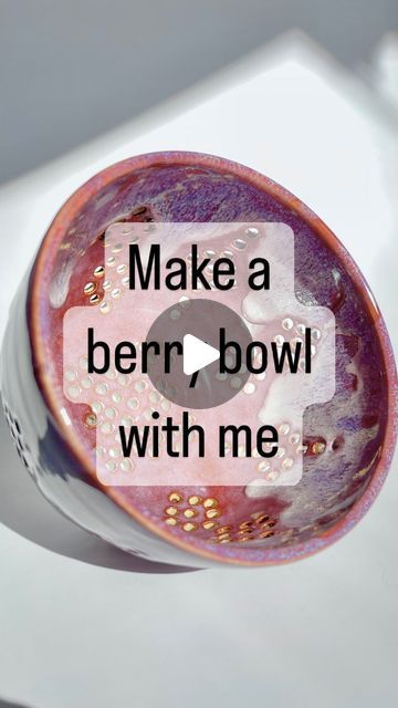 a close up of a bowl on a table with the words make a berry bowl with me