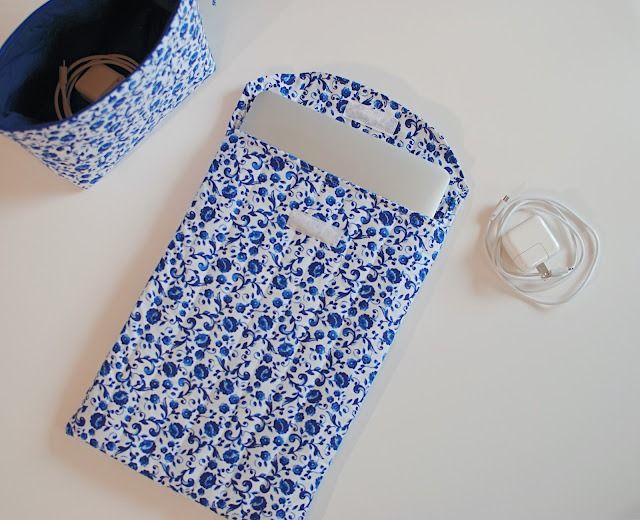 a blue and white bag sitting on top of a table