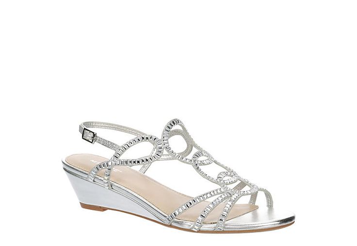 a woman's silver wedged sandal with crystal embellishments and an open toe