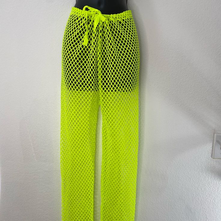 Neon Yellow Cover Up Pant. It Comes In One Size, It’s 52% Cotton, 36% Polyester And 12%Spandex. Trendy Pants For Beach Vacation, Trendy Pants For Beach Season Vacation, Spring Stretch Beachwear Pants, Stretch Beachwear Pants For Spring, Trendy Beach Season Vacation Pants, Green Stretch Pants For Vacation, Full Length Green Vacation Bottoms, Trendy Pants With Elastic Waistband For Beach Season, Trendy Full-length Pants For Vacation