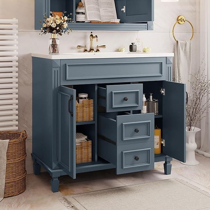 a bathroom vanity with blue cabinets and white counter top, next to a basket on the floor