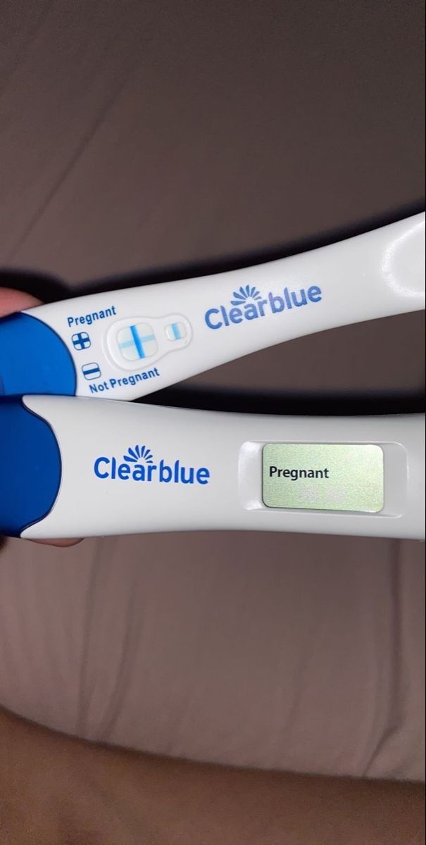 two blue and white toothbrushes in someone's hand with the words clearblue on them