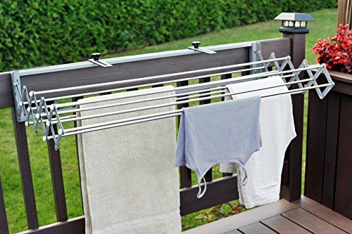 two towels hanging on a clothes line next to a potted plant with red flowers