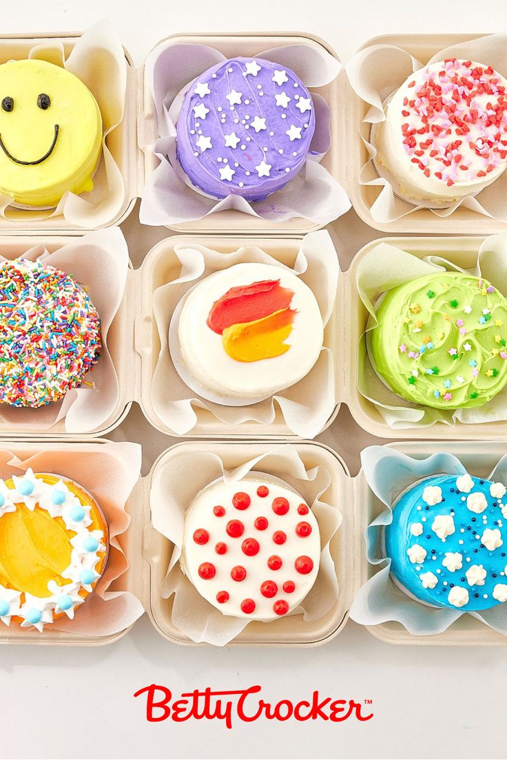 an assortment of decorated doughnuts in trays