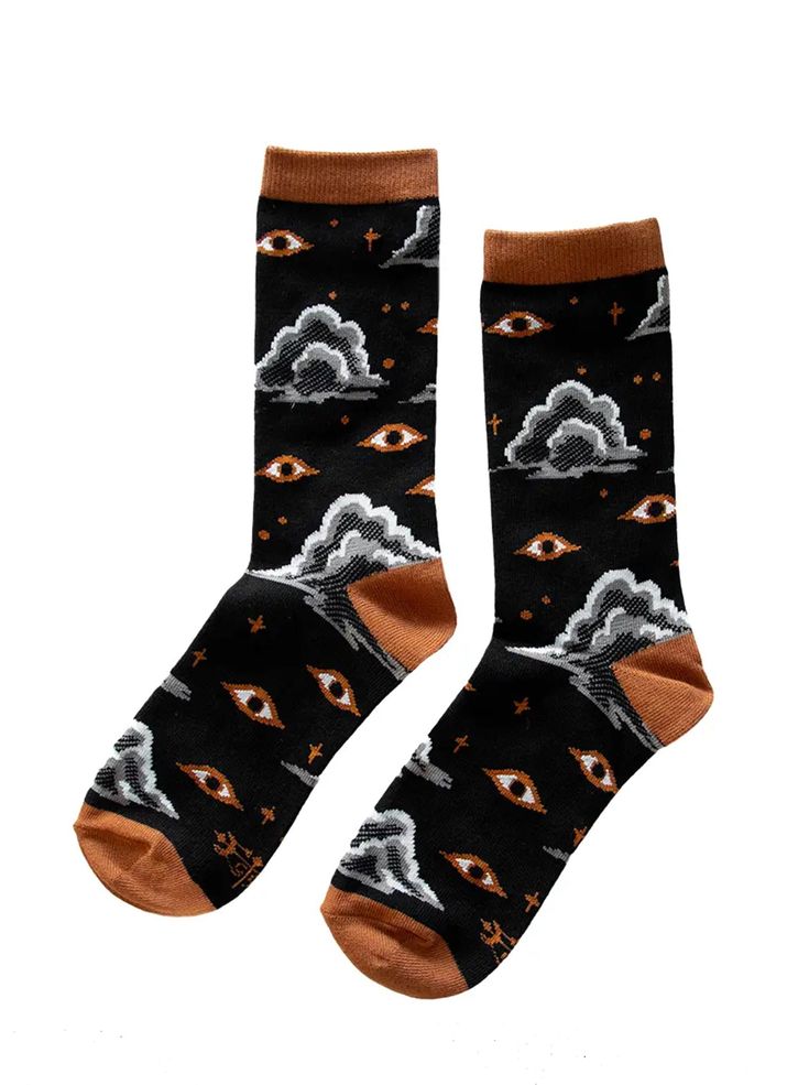 About this product - Cozy 80% combed cotton, 15% polyester, 5% spandex. - Unisex. One size fits most. - Machine wash cold. Hang dry recommended. - Designed by Ectogasm in Los Angeles An eye in the sky. These socks feature a surreal vision of firmament dotted with thunderheads, stars, and golden eyes that float like flying saucers. In tones of black, burnt orange, and grey, they look stylish with any outfit. Details • Made in China • Fabric: 80% cotton, 15% polyester, 5% spandex • Care Instructio Eye In The Sky, Starry Eyes, Flying Saucers, Golden Eyes, Witch Decor, Capricorn And Aquarius, Taurus And Gemini, Hair Fragrance, Amethyst Bracelet