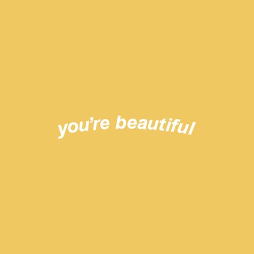 the words you're beautiful written in white on a yellow background