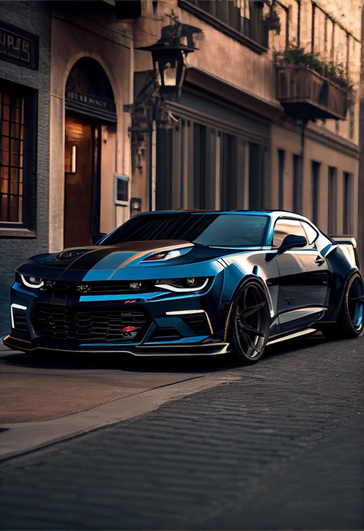 a blue chevrolet camaro parked on the side of a street next to a building