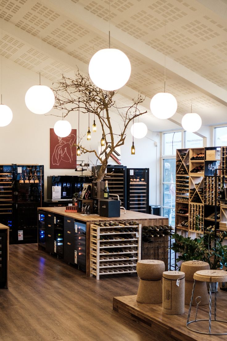 a wine shop with lots of bottles and lights