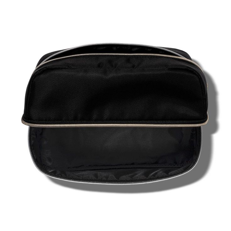 Add functional flair to your cosmetic storage options with this sleek and stylish Toiletry Bag from Sonia Kashuk™. The bold black hue and exposed zippers in a champagne gold tone along the top and side lend a chic, modern vibe to this case. Designed to stand up on its own, it sports a spacious main compartment and a top and middle zipper closure for versatile use. The lightweight recycled polyester construction means it won’t add extra weight in your suitcase or backpack, making it a convenient Luxury Black Rectangular Cosmetic Bag, Modern Travel Cosmetic Bag With Zipper Pocket, Modern Black Travel Cosmetic Bag, Modern Rectangular Cases With Zipper Pouch, Black Zipper Pouch Cosmetic Bag For On-the-go, Elegant Black Portable Cosmetic Bag, Elegant Portable Black Cosmetic Bag, Black Travel Cosmetic Storage With Zipper Pouch, Luxury Black Bags With Metal Zipper