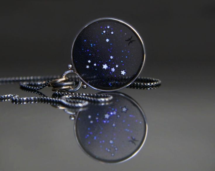 This Pisces Constellation Necklace is a sparkling star map of the stars of Pisces. Any of the other zodiac signs are also available in the options dropdown. The frame is sterling silver, the original hand colored graphic is embedded in clear resin. It measures 3/4 inch diameter, and almost one inch top to bottom. The chain is sterling silver with an antique patina that will never need polishing. Jackie Taylor, Pisces Constellation Tattoo, Moon Resin, Aries Constellation Tattoo, Plique A Jour, Aries Constellation, Pisces Constellation, Glow Art, Constellation Tattoos