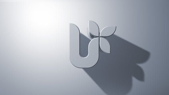 the letter u is made up of leaves and has a shadow on it's surface