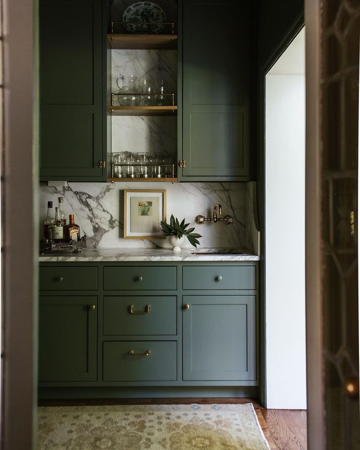 the instagram page for instagram com shows an image of a kitchen with green cabinets and marble counter tops