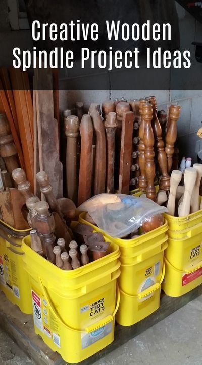 some yellow buckets filled with different types of wood