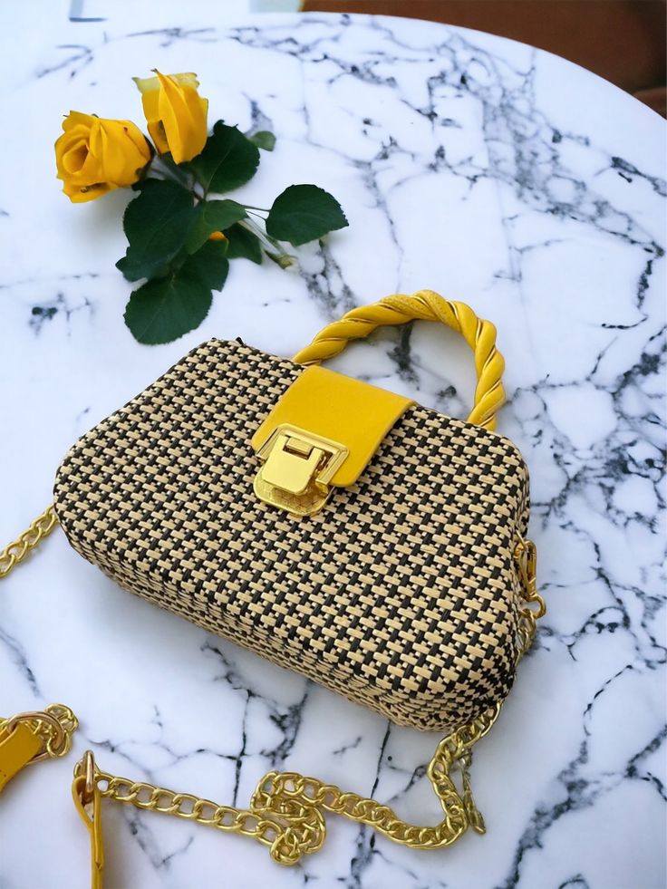 Experience luxury with our Geometric Light Weight Yellow Hand Bag. This sophisticated, exclusive piece is the perfect addition to your wardrobe. Its intricate pattern and high-quality materials make it both elegant and durable. Whether for a chic vacation or a day in the city, its chain and top handle strap provide versatility while the 100% polyurethane coating ensures long-lasting beauty. Treat yourself to this must-have piece and elevate your style to a new level. Size Bag Height Bag Length B Chic Square Box Bag With Chain Strap, Summer Rectangular Shoulder Bag With Chain Strap, Gold Top Handle Bag For Spring, Summer Square Bag With Chain Strap, Chic Square Box Bag For Spring, Trendy Box Bag With Gold-tone Hardware For Shopping, Elegant Rectangular Bag With Chain Print, Gold Top Handle Shoulder Bag For Spring, Chic Yellow Box Bag For Shopping