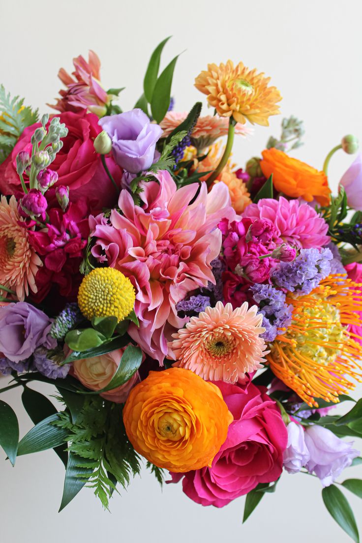 a bunch of flowers that are sitting on a table