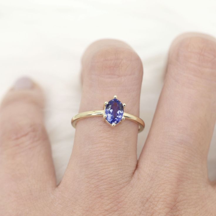 14k Oval Tanzanite Engagement Ring | 7x5MM Solitaire Natural Tanzanite Wedding Ring | 14k Tanzanite Ring | Tanzanite Solitaire Ring | Handmade Jewelry P R O D U C T 𝄪 D E T A I L S ✽ Metal: 14k Yellow Gold, White Gold & Rose Gold ✽ Bottom Band Width: 1.5 MM ✽ Center Stone: Natural Tanzanite 7 x 5 MM ✽ Made to Order ✽ Curved Band Suggestion: https://etsy.me/3qvEF87 O T H E R 𝄪 I N F O R M A T I O N ▪ All items are custom made to order ▪ Rush order: Please contact us before place your order to e Oval Tanzanite Birthstone Ring, Oval Tanzanite Birthstone Promise Ring, Tanzanite Oval Birthstone Promise Ring, Tanzanite Solitaire Ring, Tanzanite Engagement Ring, Tanzanite Ring, Natural Tanzanite, Ring Handmade, Solitaire Ring