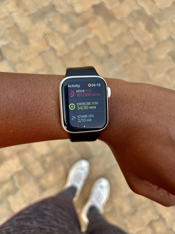 a close up of a person's arm with an apple watch on their wrist