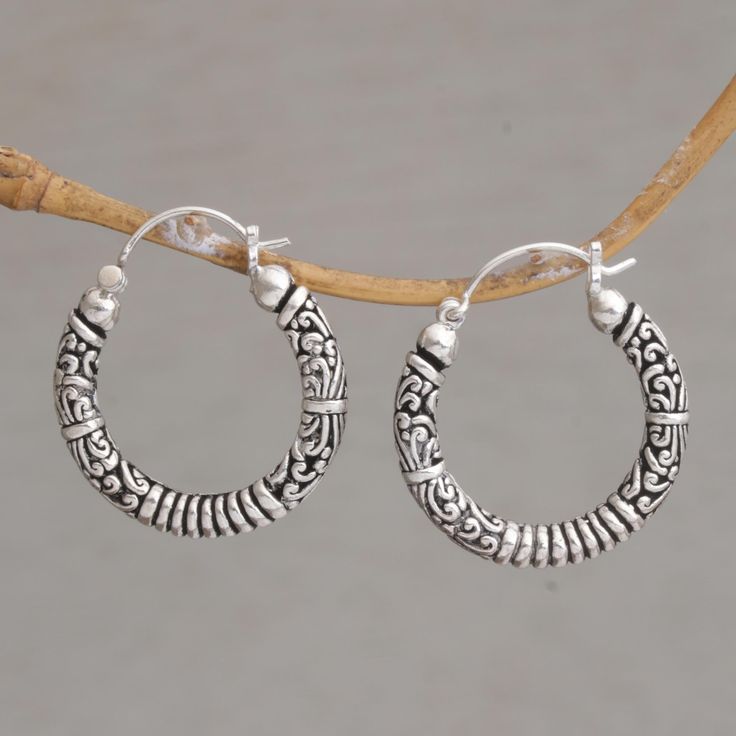 Lightweight rings of sterling silver are detailed with beautiful swirling patterns that loop below the ears with grace. Designed by Dewa Arimbawa, these Balinese hoop earrings make a striking statement wherever they go. Sterling silver Saddleback / sea catch earrings Combination finish Handmade in & fairly traded from Indonesia Bali Silver, Garnet Pendant, Silver Jewelry Fashion, Sterling Silver Hoop Earrings, Balinese, Contemporary Jewelry, Sterling Silver Hoops, Silver Hoops, Jewelry Gift Box