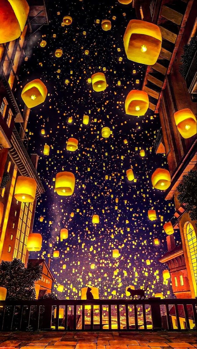 many lanterns are floating in the air at night