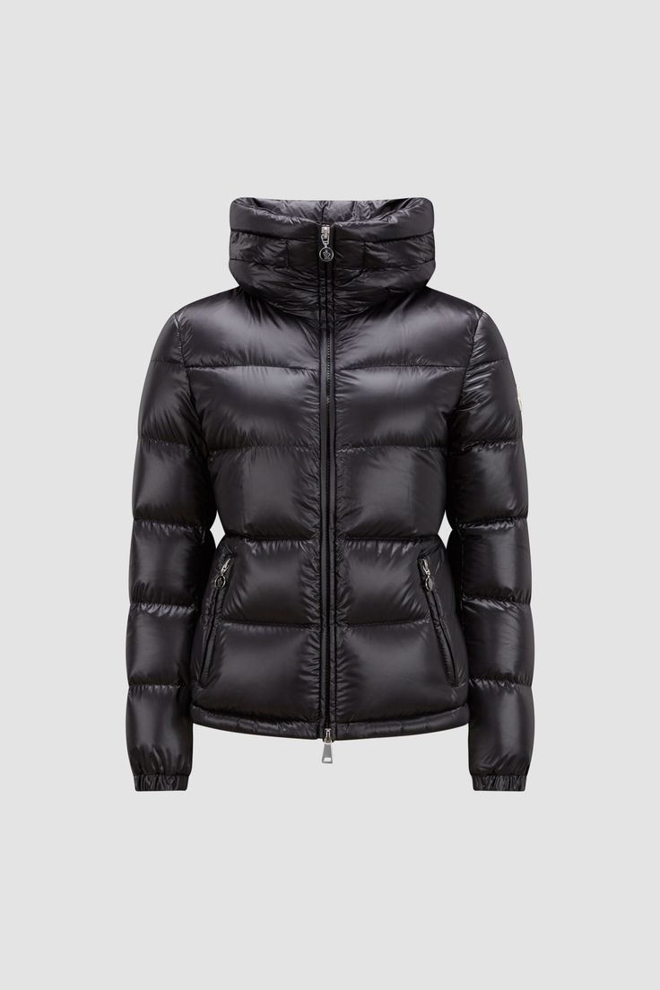 A modern take on a classic puffer, the Douro down jacket presents tactical quilting designed to enhance the silhouette. The short puffer is crafted from recycled longue saison, a nylon fabric notable for providing supreme warmth while maintaining a light weight. The jacket is finished with a practical pull-out hood hidden in the stand collar. Women Puffer Jacket, Womens Moncler Jacket, Luxury Hooded Nylon Puffer Jacket, Luxury Black Puffer Jacket With Zipper Closure, Moncler Maya 70 Short Down Jacket, Black Luxury Puffer Jacket With Double-lined Hood, Moncler Women, Down Jackets, Nylon Fabric