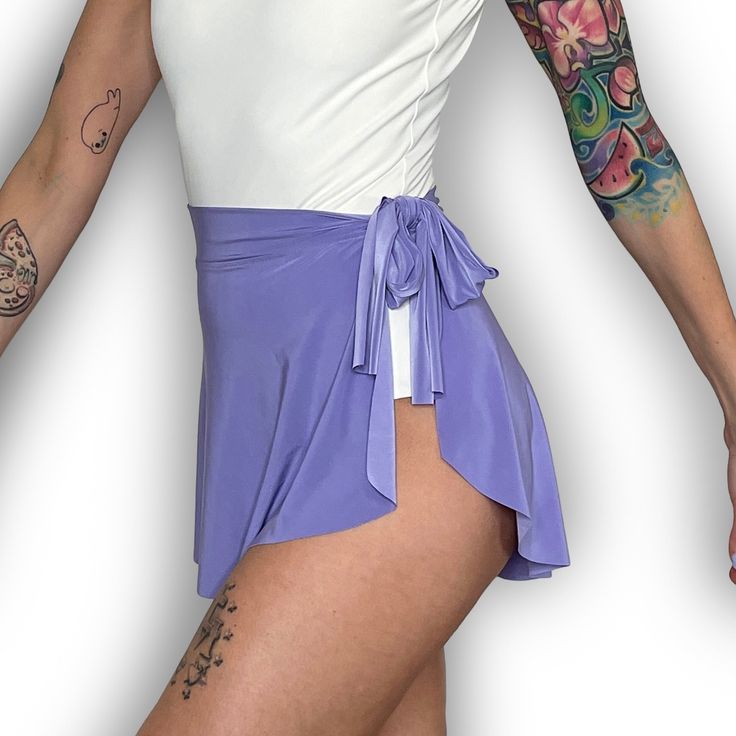 "Demi Wrap Skirts are made with an opaque, lightweight, poly/spandex blend fabric that is lightweight, 4-way stretch, and drapes beautifully on the body. Slightly longer in the back, these fun and versatile ballet mini skirts can be doubled as a swimsuit cover. Wrap style with a 1.75\" fabric waistband that ties on your left and has a sweetheart cut at the right side seam." Stretch Nylon Skirt With Built-in Shorts, Swim Skirt With Built-in Shorts And Flowy Fit, Beach Mini Skirt With Built-in Shorts And Stretch, Flowy Skort With Built-in Shorts For Summer, Spring Stretchy Tennis Skirt With Wide Waistband, Spring Stretch Tennis Skirt With Wide Waistband, Versatile Summer Tennis Skirt With Built-in Shorts, Spring Swim Skirt With Built-in Shorts, Flowy Swim Skirt With Built-in Shorts