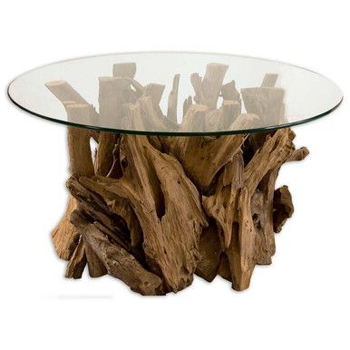 a glass table topped with driftwood pieces