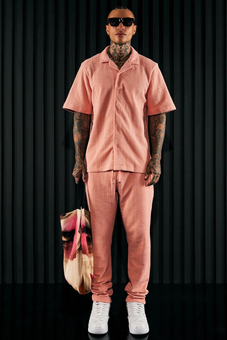 Model Height: 6'4 - Wearing Large Big & Tall: Height 6'5 - Wearing XXXL Available In Mauve. Fold Down Collar Front Button Closure Short Sleeve 62% Cotton, 38% Polyester Pair With "Dean Textured Slim Pant" Imported | Mens Dean Textured Short Sleeve Button Up Shirt in Mauve size Small by Fashion Nova Casual Loungewear Shirt With Button Closure, Casual Buttoned Shirt For Loungewear, Casual Loungewear Shirt, Pink Button-up Shirt For Loungewear, Casual Camp Shirt With Camp Collar, Casual Relaxed Fit Camp Shirt For Daywear, Casual Camp Shirt For Spring, Casual Camp Shirt For Spring Daywear, Casual Camp Collar Shirt For Daywear