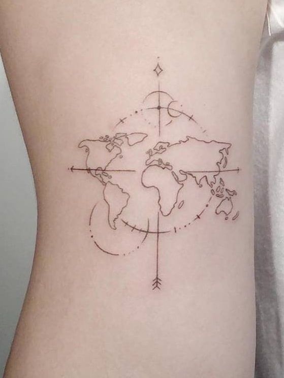 a woman's stomach with a map tattoo on the back of her body and an arrow