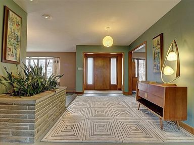 the hallway is clean and ready for us to use as an entrance way in this house