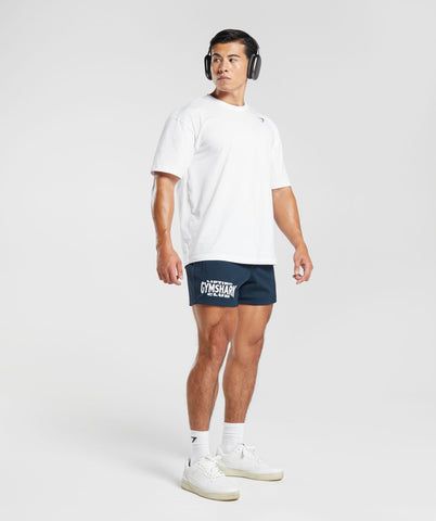 IN THE CLUB Rep the Gymshark Lifting Club all day, everyday in this collection. • Drawcord waist for an adjustable fit• Open side pockets for storage• Gymshark Lifting Club graphic to front SIZE & FIT• Regular fit• 5” inseam based on size M• Model is 6'0" and wears size M MATERIALS & CARE• 90% Nylon, 10% Elastane• 260gsm, heavyweight fabric• Mesh material SKU: A6A2H-UB9P Men's Workout Clothes Gymshark, Functional Gym Shorts With 5-inch Inseam, Gymshark Mens Shorts, Blue Squat-proof Sports Shorts, Sportswear Boxer Briefs With Built-in Shorts For Gym, Mesh Material, Mesh, Navy, Fabric