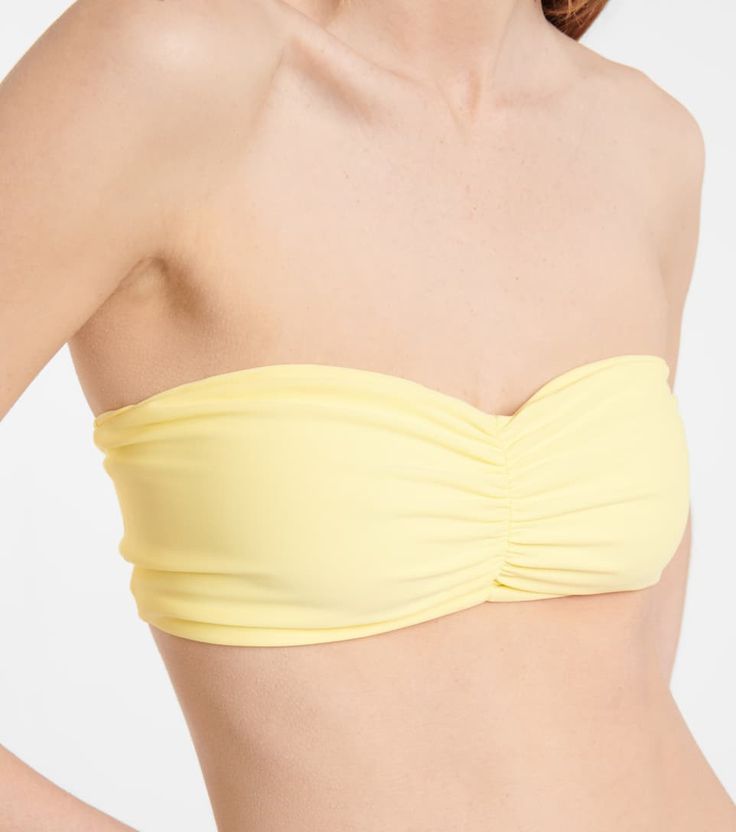 Jade Swim - Ava bandeau bikini top | Mytheresa Ruched Bandeau Swimwear For Sunbathing, Bandeau Ruched Swimwear For Sunbathing, Ruched Bandeau Swimwear For Beach Season, Strapless Ruched Swimwear For Sunbathing, Bandeau Swimwear With Padded Cups For Poolside, Beach Swimwear With Sweetheart Neckline, Bandeau Ruched Swimwear For Swimming, Seamless Bandeau Swimwear For Summer, Summer Seamless Bandeau Swimwear