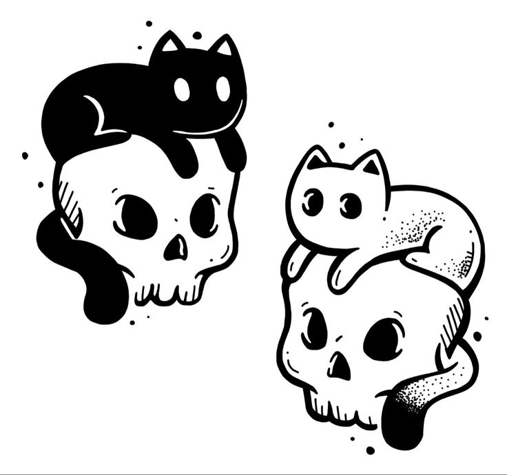 two skulls with cats on them