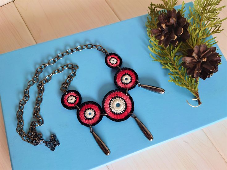 Ethnic necklace with black chain, Tribal jewelry for women, Bohemian necklace for Valentines, Adorable globetrotter gift for sister Beautiful statement crochet necklace in boho style with ethno metal elements. Absolutely unique gift for woman or man. Crochet elements are made of cotton in the melange of burgundy and red colors, white and black. ❤❤ If you take care of this necklace, it never loses its shape. After removing from the neck, it is best to put it back in the bag so that no dust settle Bohemian Black Choker Necklace, Black Bohemian Choker Necklace, Handmade Black Circle Necklaces, Handmade Circular Black Necklaces, Handmade Black Circle Necklace, Handmade Circular Black Necklace, Traditional Necklaces With Adjustable Chain, Bohemian Handmade Circle Necklace, Handmade Chain Necklace For Festival