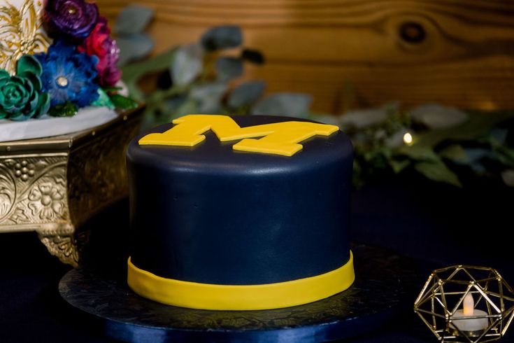 a blue and yellow cake on a table