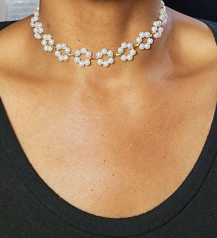 Whether you're attending a special occasion or simply want to feel fabulous, our Floral Pearl Choker is the perfect accessory to make a statement and leave a lasting impression. Embrace your inner charm and let this enchanting piece adorn your neck with sheer elegance. Elegant Rhinestone Necklace For Celebrations, Silver Adjustable Bridal Necklace For Party, Delicate Bridal Necklace For Formal Occasion, Feminine Evening Pearl Jewelry, Elegant Beaded Choker For Evening, Glamorous Metal Bridal Necklace For Weddings, Adjustable Clavicle Chain Jewelry For Party, Chic White Choker Jewelry, Adjustable Clavicle Chain For Parties