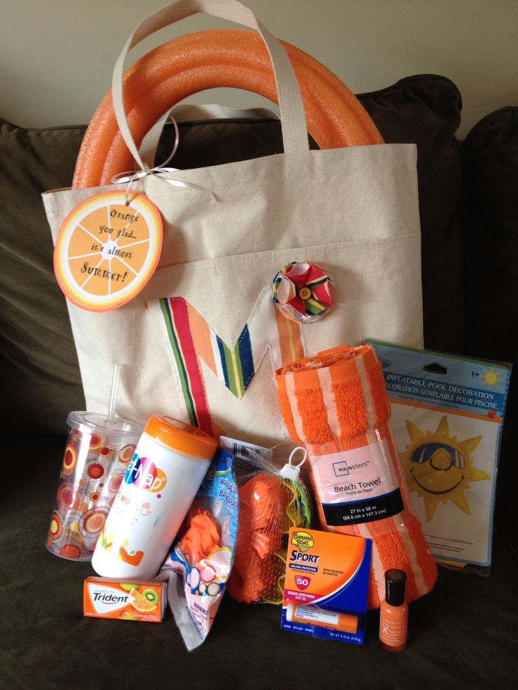 a bag filled with baby items sitting on top of a couch