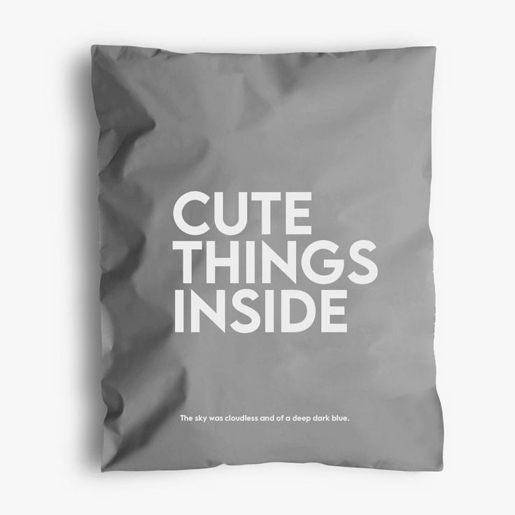 a pillow with the words cute things inside on it in white letters, against a gray background