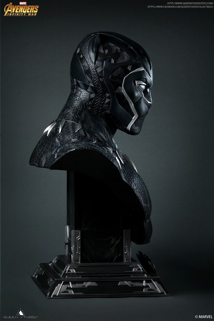 the avengers helmet is on display in front of a black background