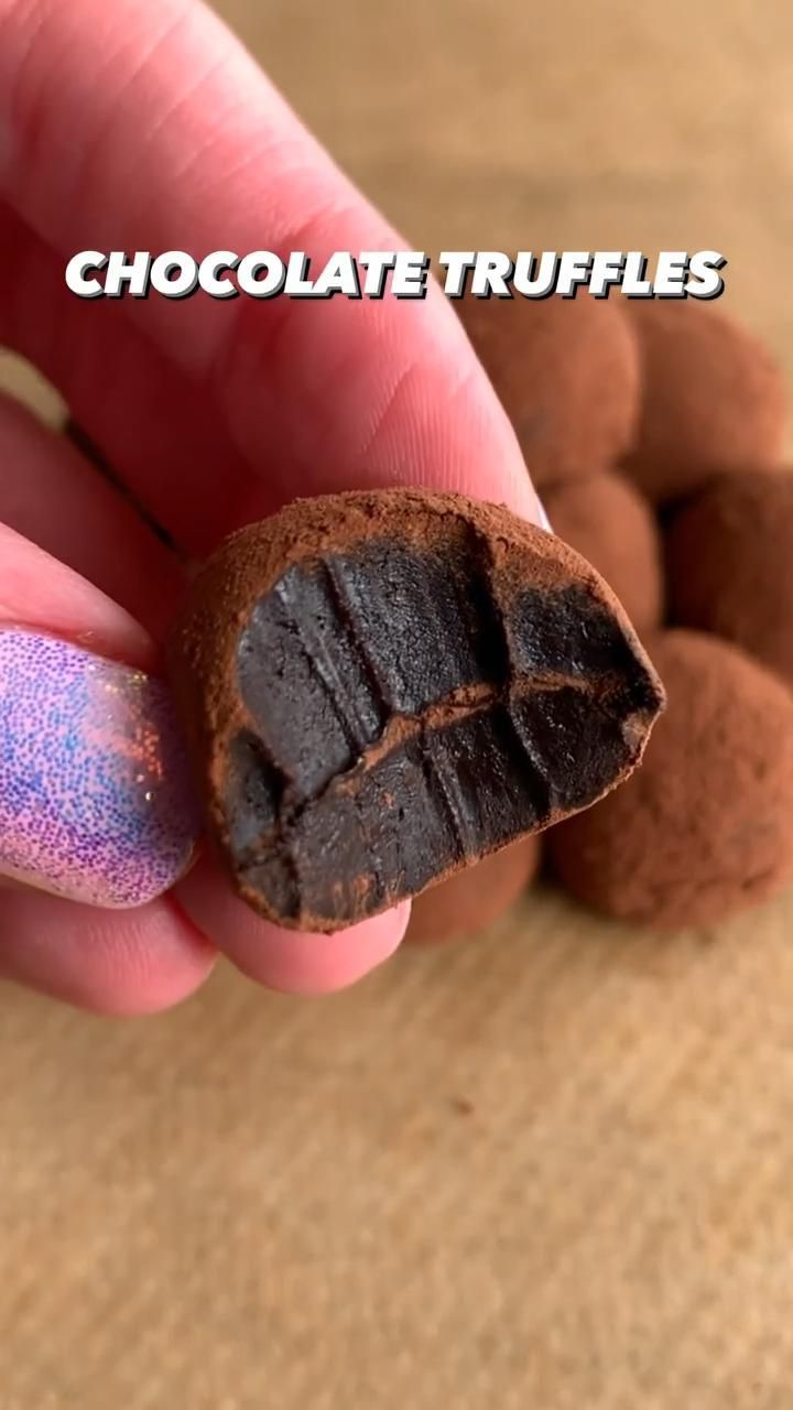 a hand holding a chocolate truffles in it's palm with the word chocolate truffles written on it