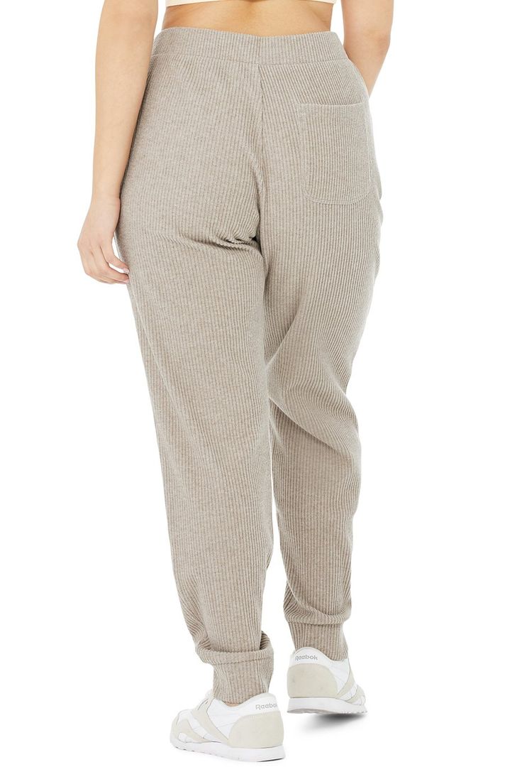 Total live-in material. The Muse Sweatpant takes comfort seriously—it’s made with a soft ribbed knit and has a relaxed silhouette, drawstring closure and pockets at side and back. Wear it with the matching hoodie or an easy tank. An iconic Alo fave So comfy & all-day cute Designed & uniquely fit to flatter every size Wear-tested by our in-house team for the perfect fit Alo Yoga® | Muse Sweatpant in Gravel Heather, Size: Medium Alo Yoga Bottoms With Ribbed Waistband, Athleisure Ribbed Lounging Bottoms, Ribbed Athleisure Bottoms For Lounging, Alo Yoga Athleisure Loungewear Bottoms, Sporty Ribbed Lounging Bottoms, Alo Yoga Athleisure Bottoms For Loungewear, Comfortable Ribbed Sweatpants For Loungewear, Comfy Bottoms With Ribbed Waistband For Relaxation, Casual Ribbed Bottoms For Lounging