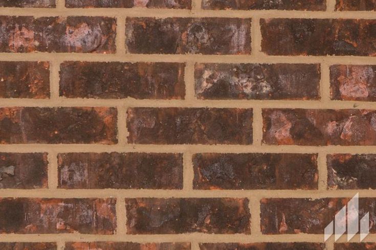 a brick wall that is made out of brown bricks